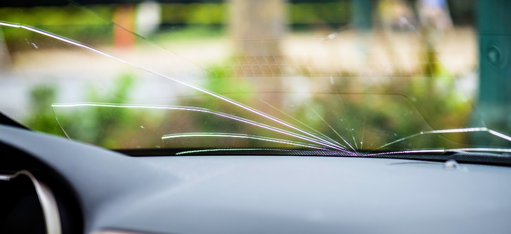 Cracked windshield that could get a ticket in Illinois.